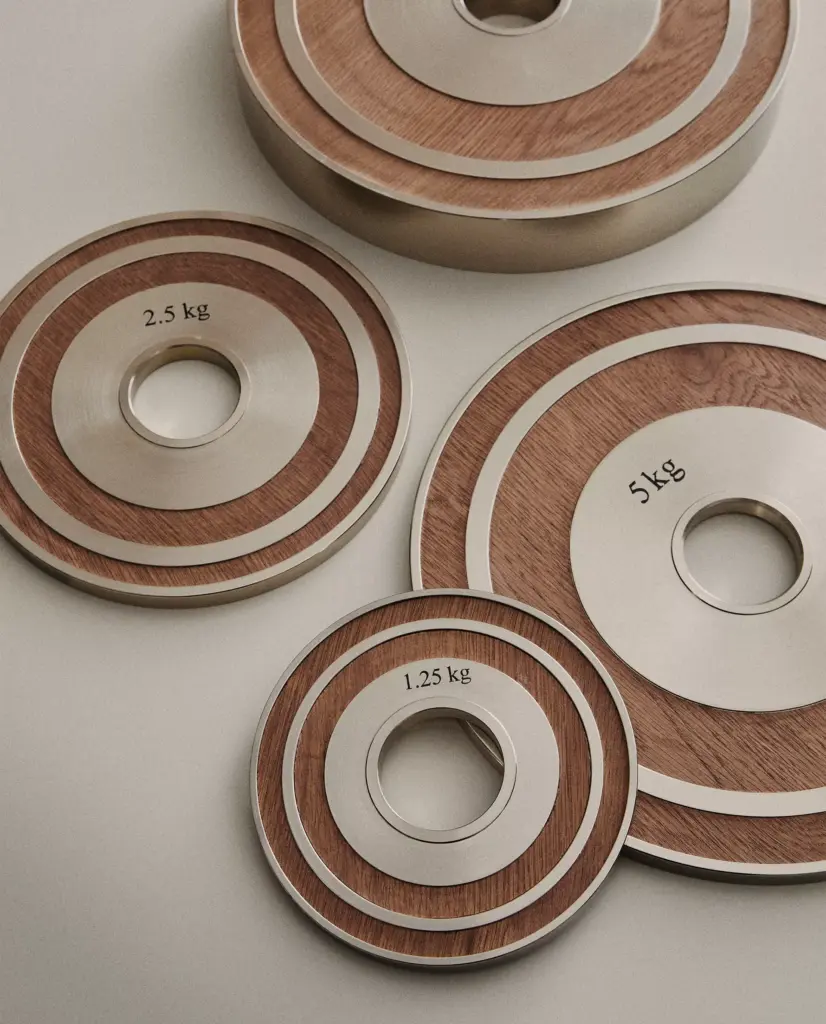 Wooden weight plates from the 2026 Zara Home Gym Collection.