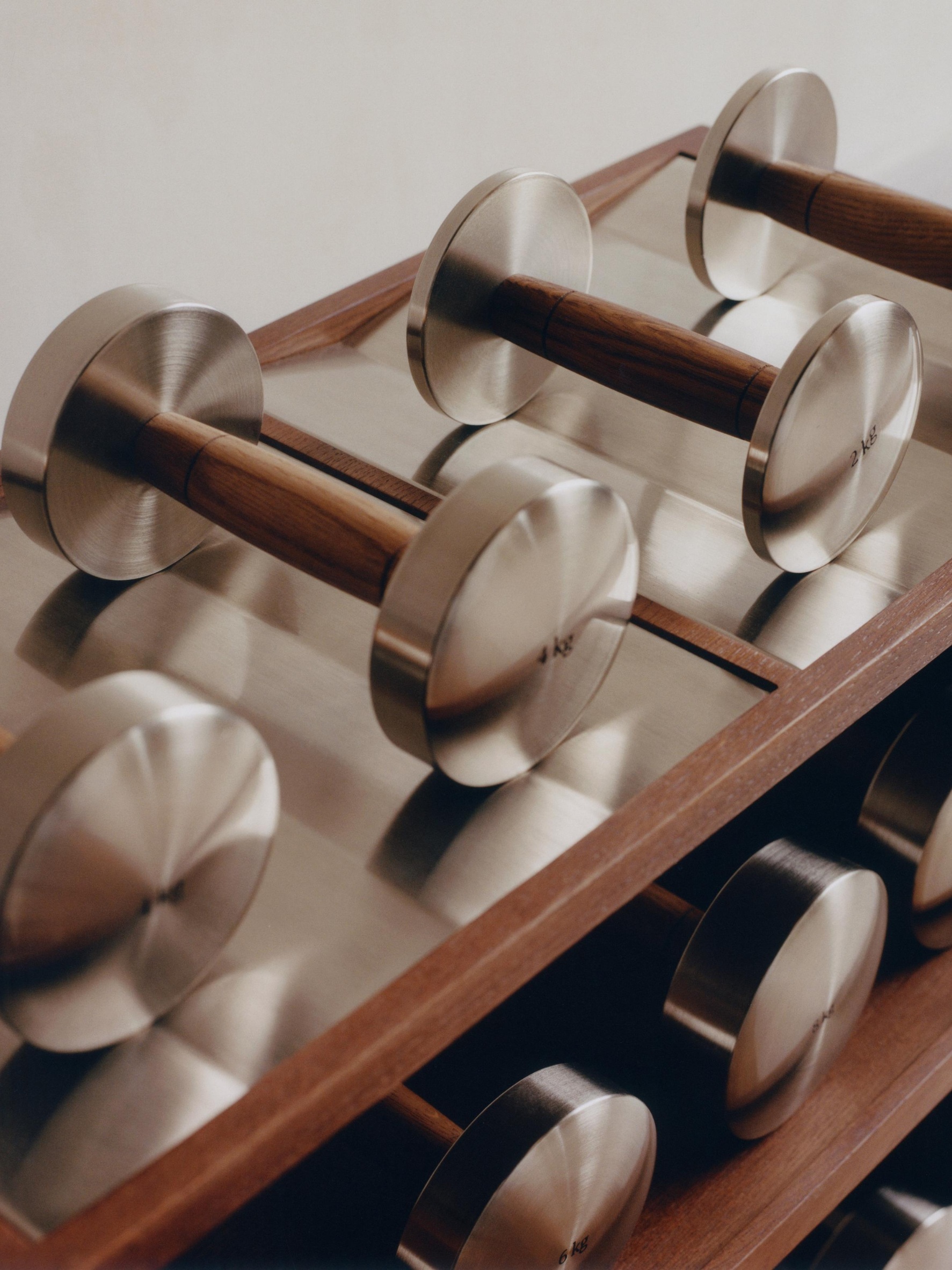 Oak and steel dumbbell from the 2026 Zara Home Gym Collection.