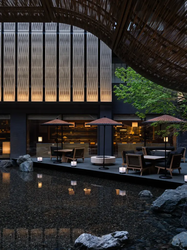 Inner courtyard at Capella Kyoto, with karahafu roof and tsuboniwa garden inspired by traditional machiya design.