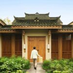 A traditional Chinese-style wooden villa at Six Senses Qing Cheng in China, designed by Bangkok studio Habita Architects.