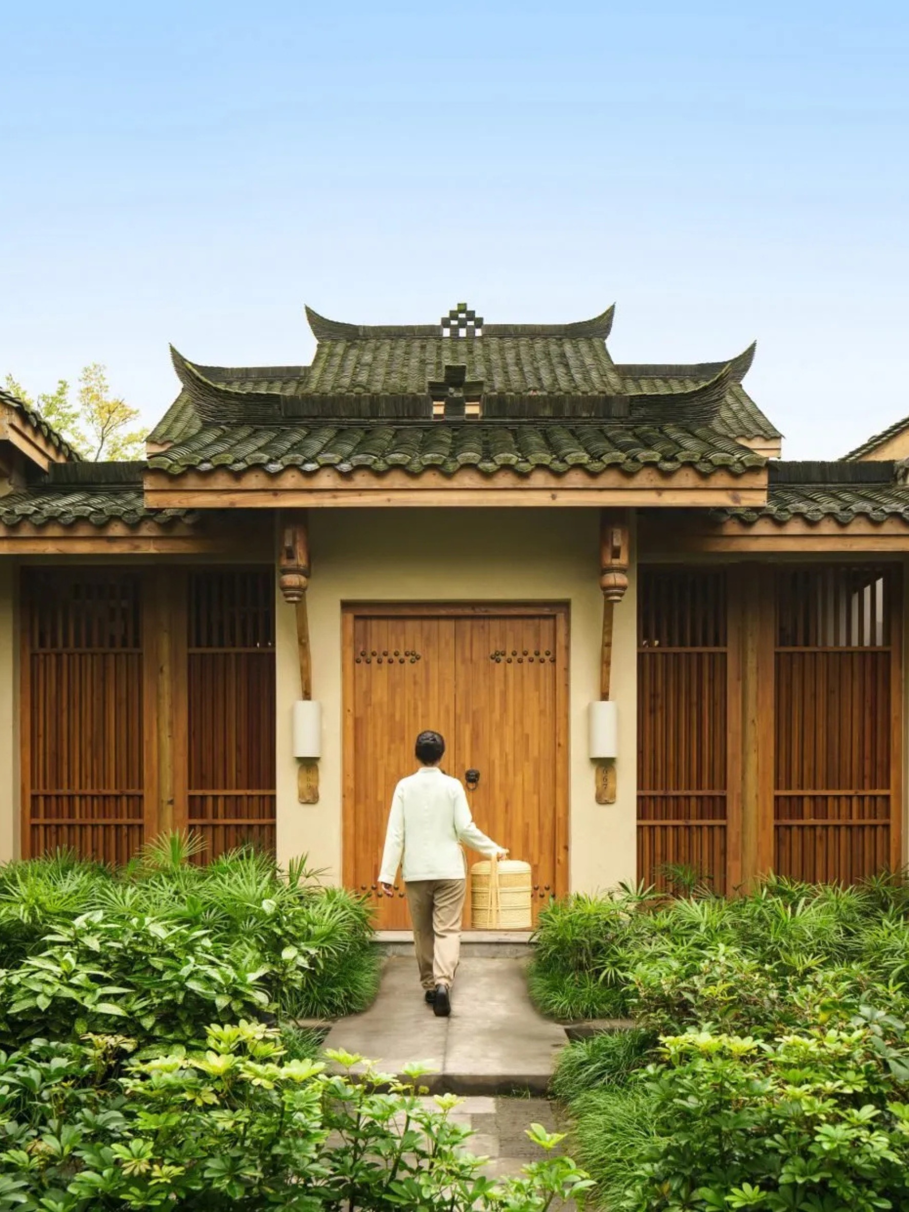 A traditional Chinese-style wooden villa at Six Senses Qing Cheng in China, designed by Bangkok studio Habita Architects.