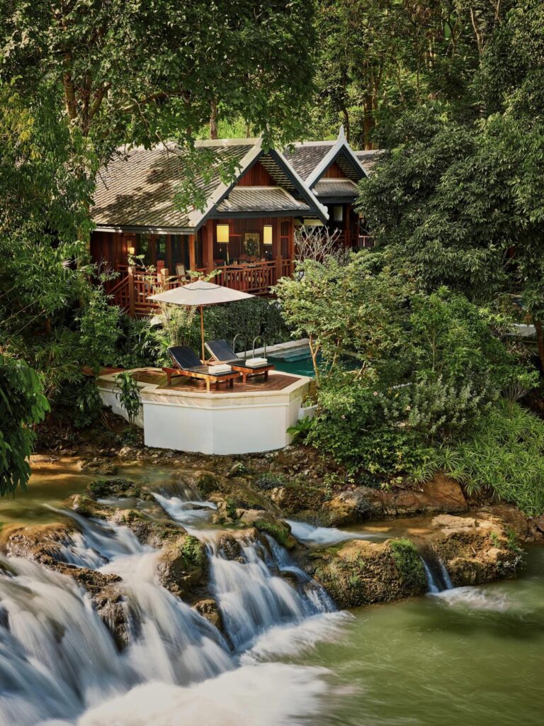 Waterfall and creek running through the grounds of Rosewood Luang Prabang in Laos
