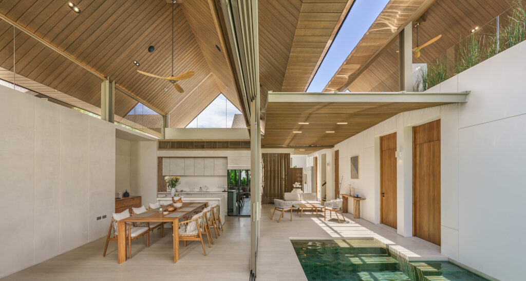 ANSAYA Phuket villa living room in Phuket, Thailand, opening through floor-to-ceiling glass doors