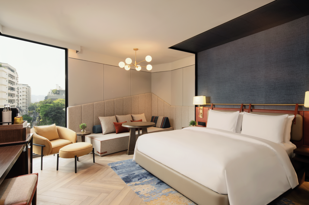 Room at Canopy Bangkok Sukhumvit with a window seat and city view
