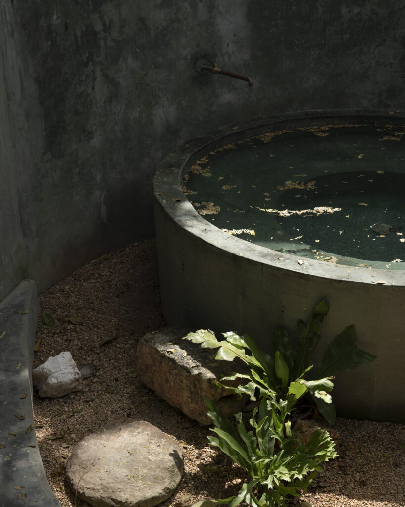 a circular outdoor concrete bathtub inspired by the region’s cenotes at Casa Gruta in Yucatan, Mexico.